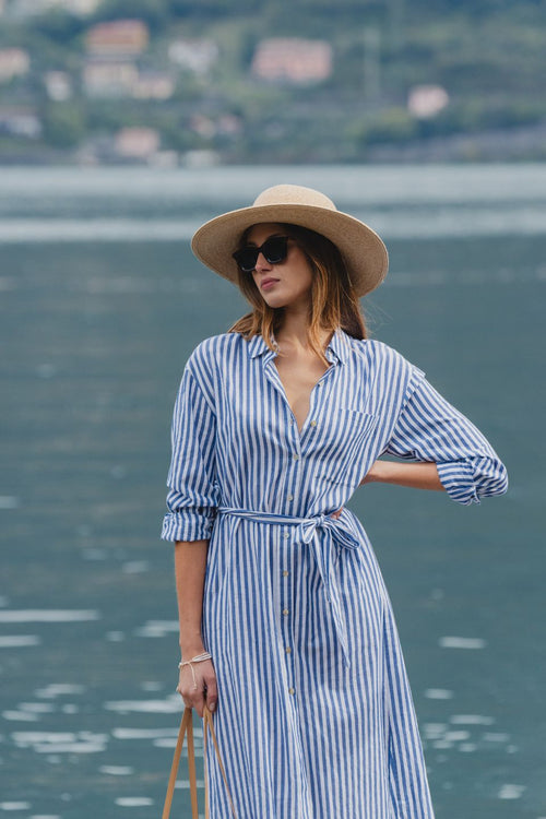 model wears a blue stripe shirt dress