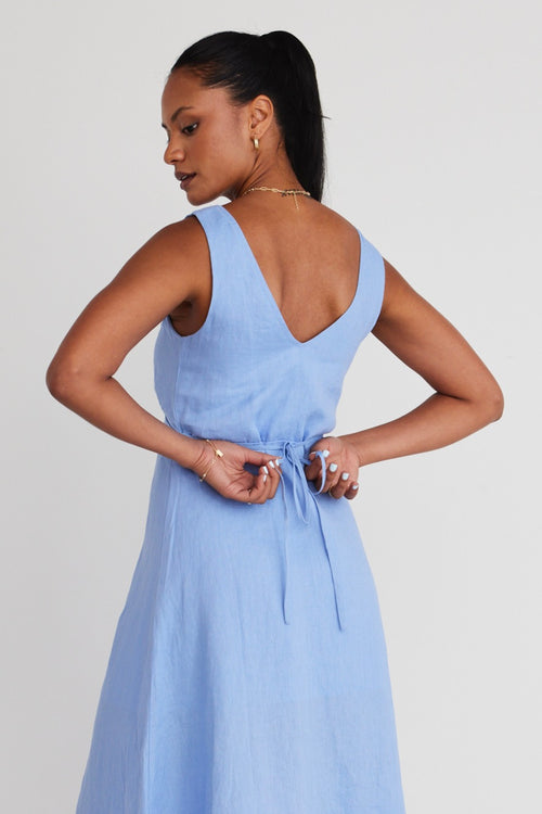 model is wearing a blue linen dress