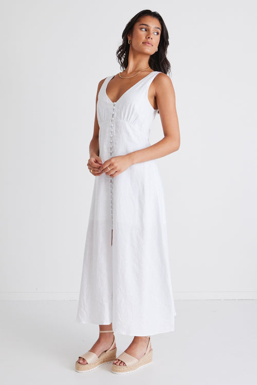 Model wears white linen sleeveless maxi dress