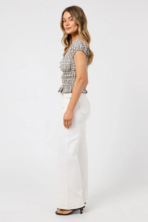 The Tilda Top in Sage Check styled with white jeans