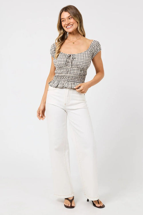 The Tilda Top in Sage Check styled with white jeans