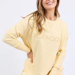 Woman wearing lemon crew neck