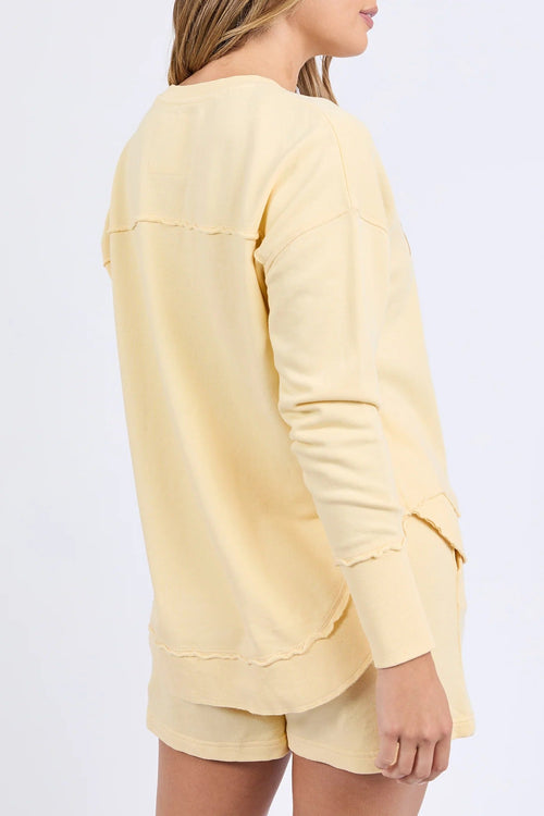 Woman wearing lemon crew neck