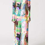 Woman wearing a colorful floral dress on a white background