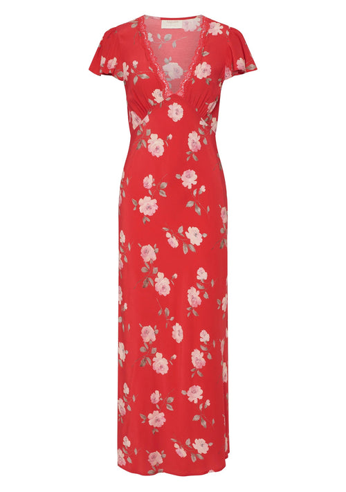 Woman wears a red floral maxi dress