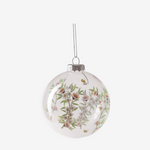 Clear glass bauble, decorated with a delicate print of white manuka blossoms, soft green foliage, and buzzing bees.