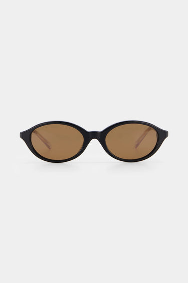 Black sunglasses with brown lenses on a white background