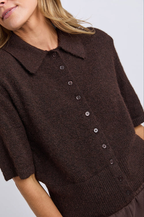 Brown short-sleeve cardigan with buttons on a plain background