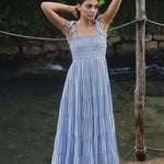 model wears a blue stripe maxi dress