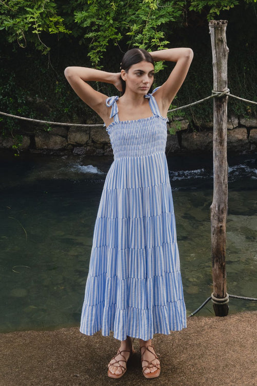 model wears a blue stripe maxi dress