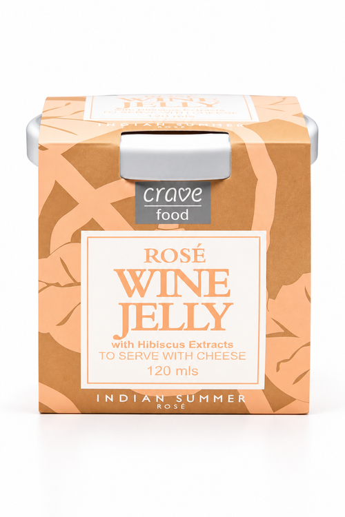 A box of Crave Food Rosé Wine Jelly, featuring a warm peach and brown patterned design with a white central label. The packaging includes a silver metal tab on top and is labeled 'Indian Summer Rose' with a volume of 120 ml.