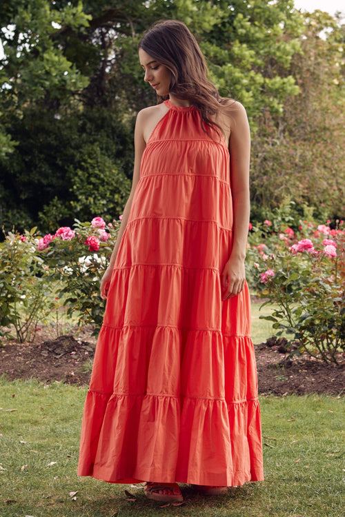 model wears Coral Tiered Maxi Dress