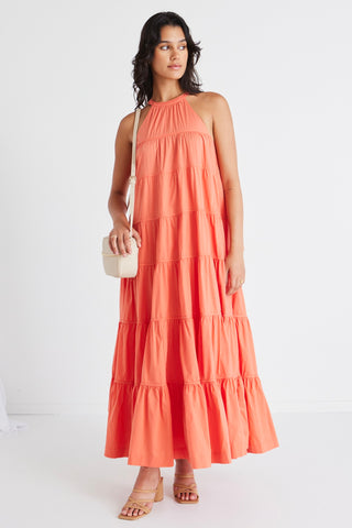 model in orange maxi dress