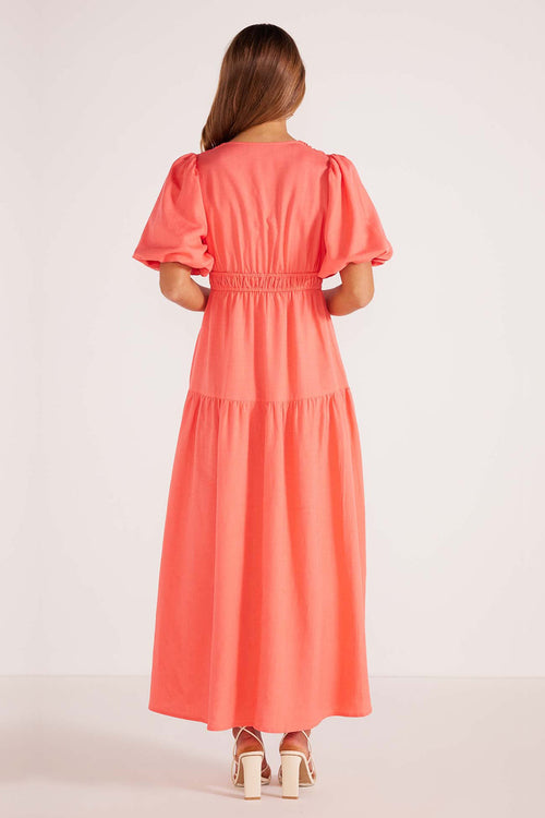 model wears a pink maxi dress