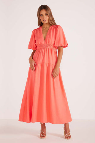 model wears a pink maxi dress