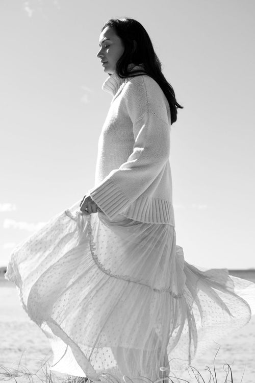 model wears a White Knit Jumper