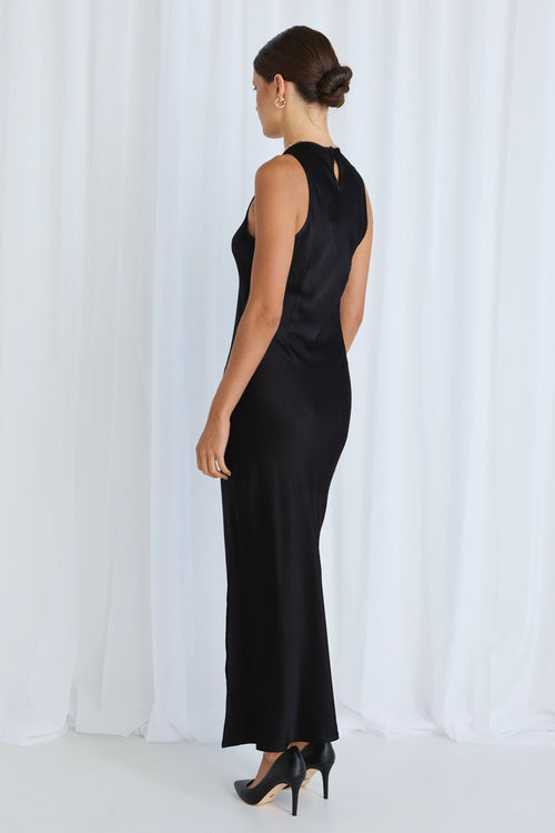 model wears a black dress