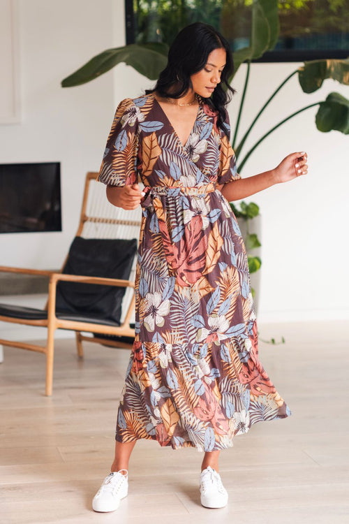 model wears a brown floral midi dress