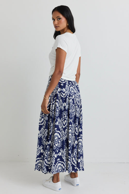 model wears a blue print maxi skirt