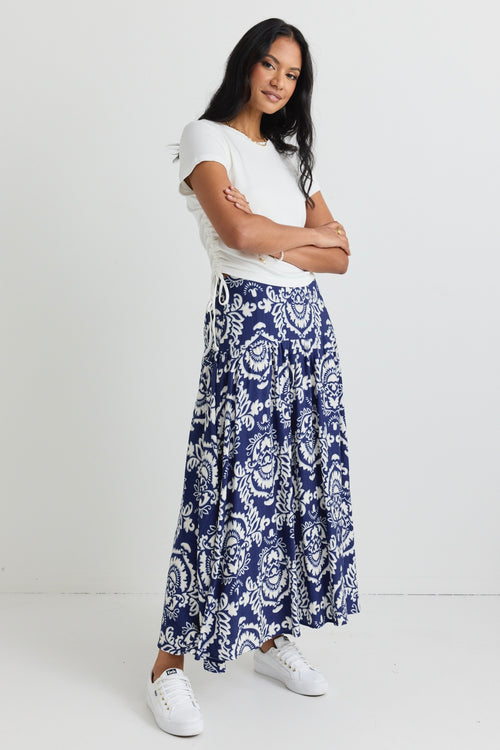 model wears a blue print maxi skirt