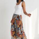 model wears a brown floral maxi skirt