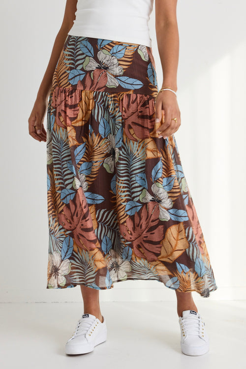 model wears a brown floral maxi skirt