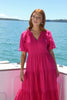 model wears a pink maxi dress