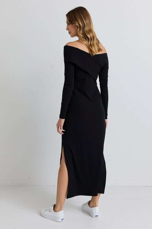 model wears a black off the shoulder maxi dress