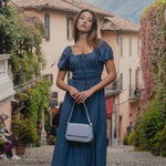 model wears a blue maxi dress