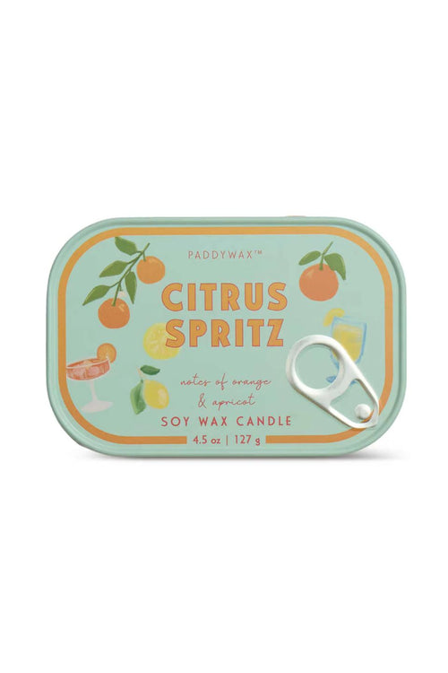 A Paddywax Citrus Spritz soy wax candle in a rectangular tin with rounded corners, featuring a light mint green background with illustrations of oranges, lemons, and cocktail glasses, plus a silver pull tab on the right side.