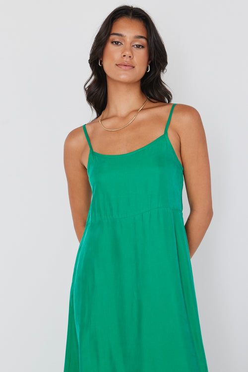 model wears long green cupro maxi dress