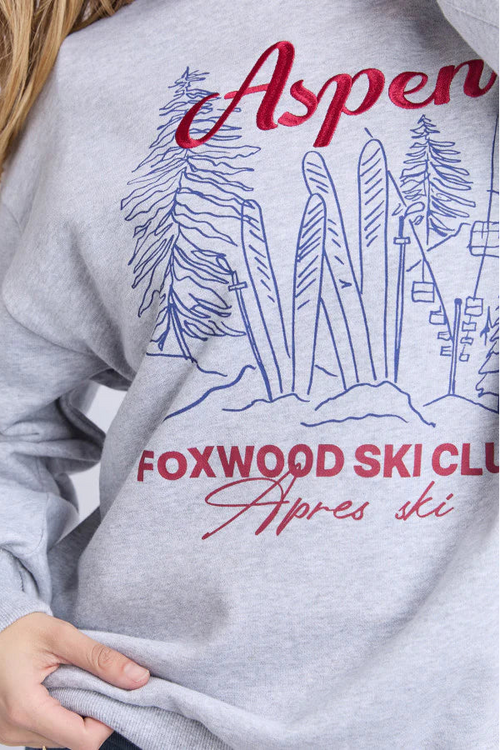 Gray sweatshirt with 'Aspen Foxwood Ski Club' design on a plain background