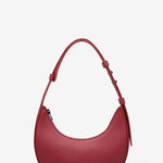 Red handbag on a light gray background