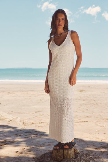 model in long white knit dress