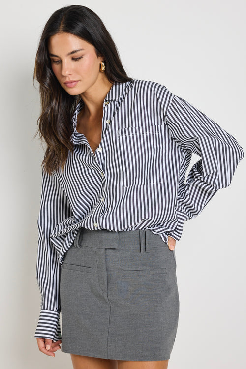 model wears a black and white stripe shirt